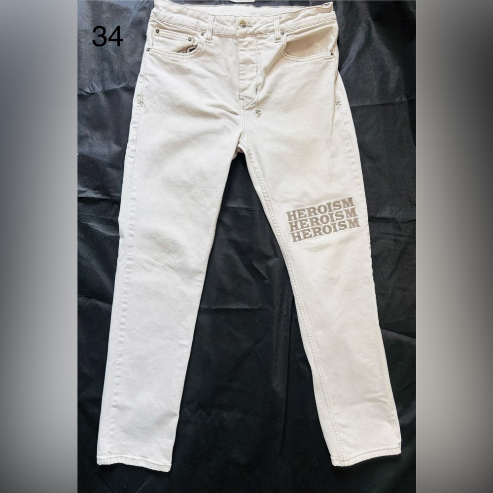 Beige Pants with Heroism Print.
